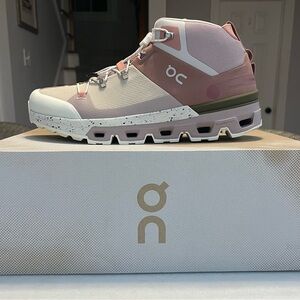 On Running Cloud Trax Pink and White High-Top Sneakers. Brand new in the box.